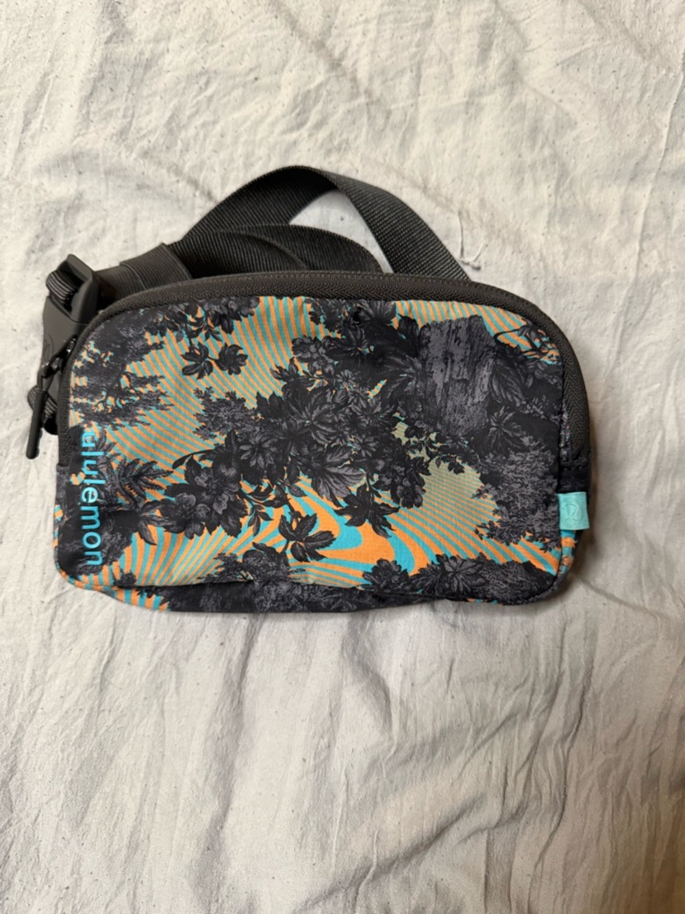 lululemon athletica Floral Wristlet Pouch in Teal, Orange & Black